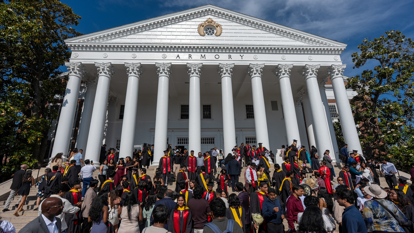 A crowd of people celebrating outside of the Armory, where Ph.D. and Masters ceremonies were held.