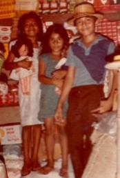 Claudia with her older brother and sister in El Salvador.