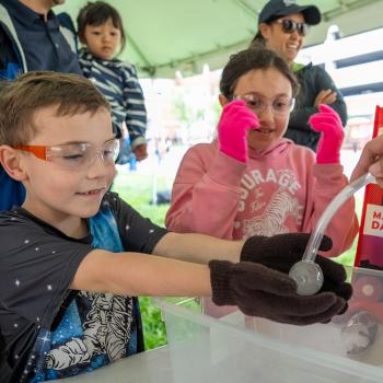 Kids participating in an experiment at Maryland Day 2025